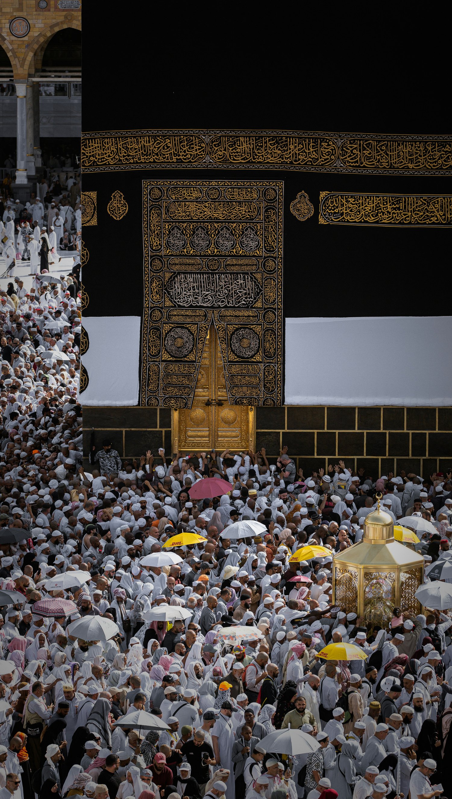 The Kaaba and its golden door amid pilgrims at Masjid al-Haram