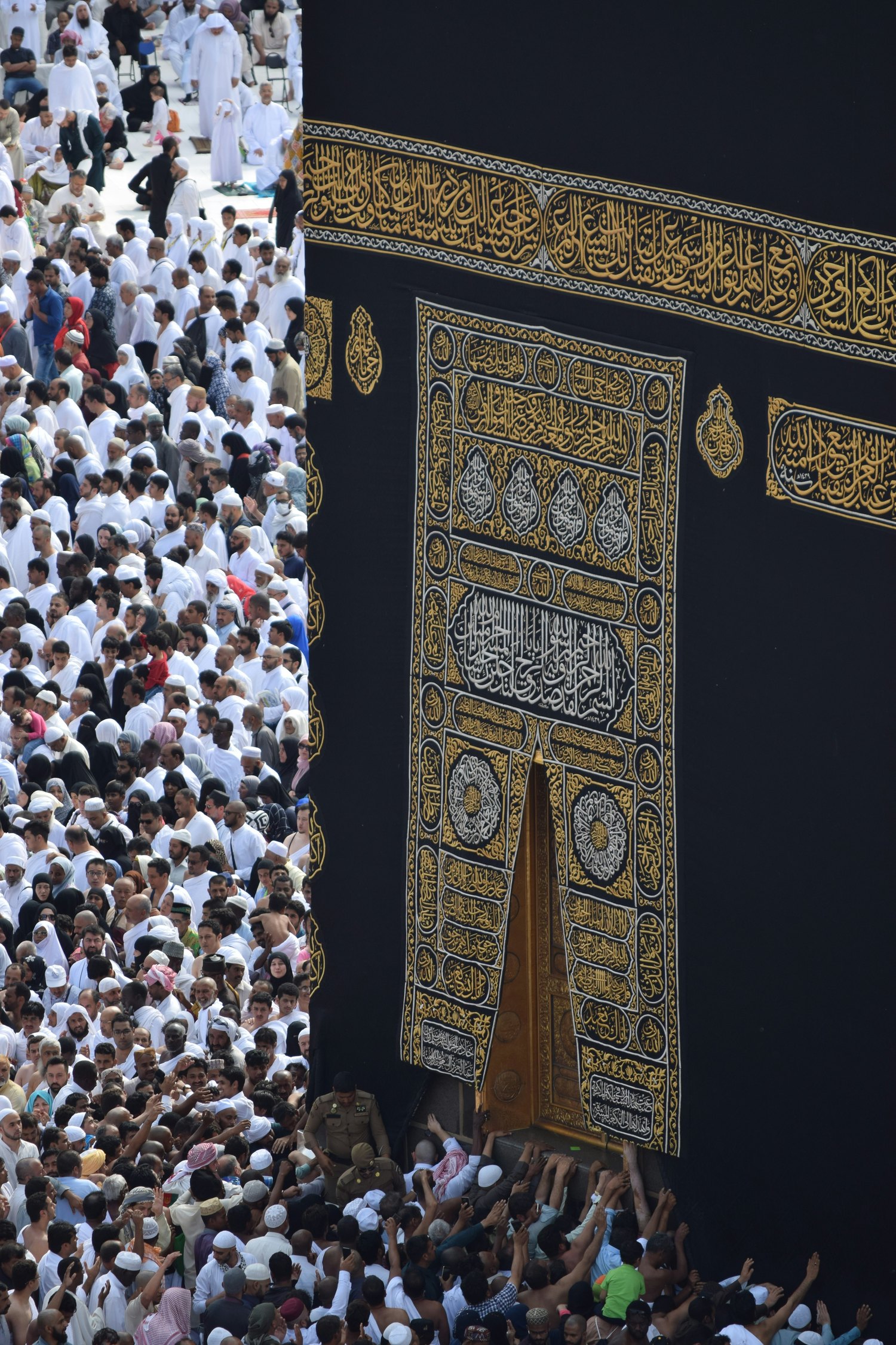 Pilgrims gathered at the golden door of the Kaaba