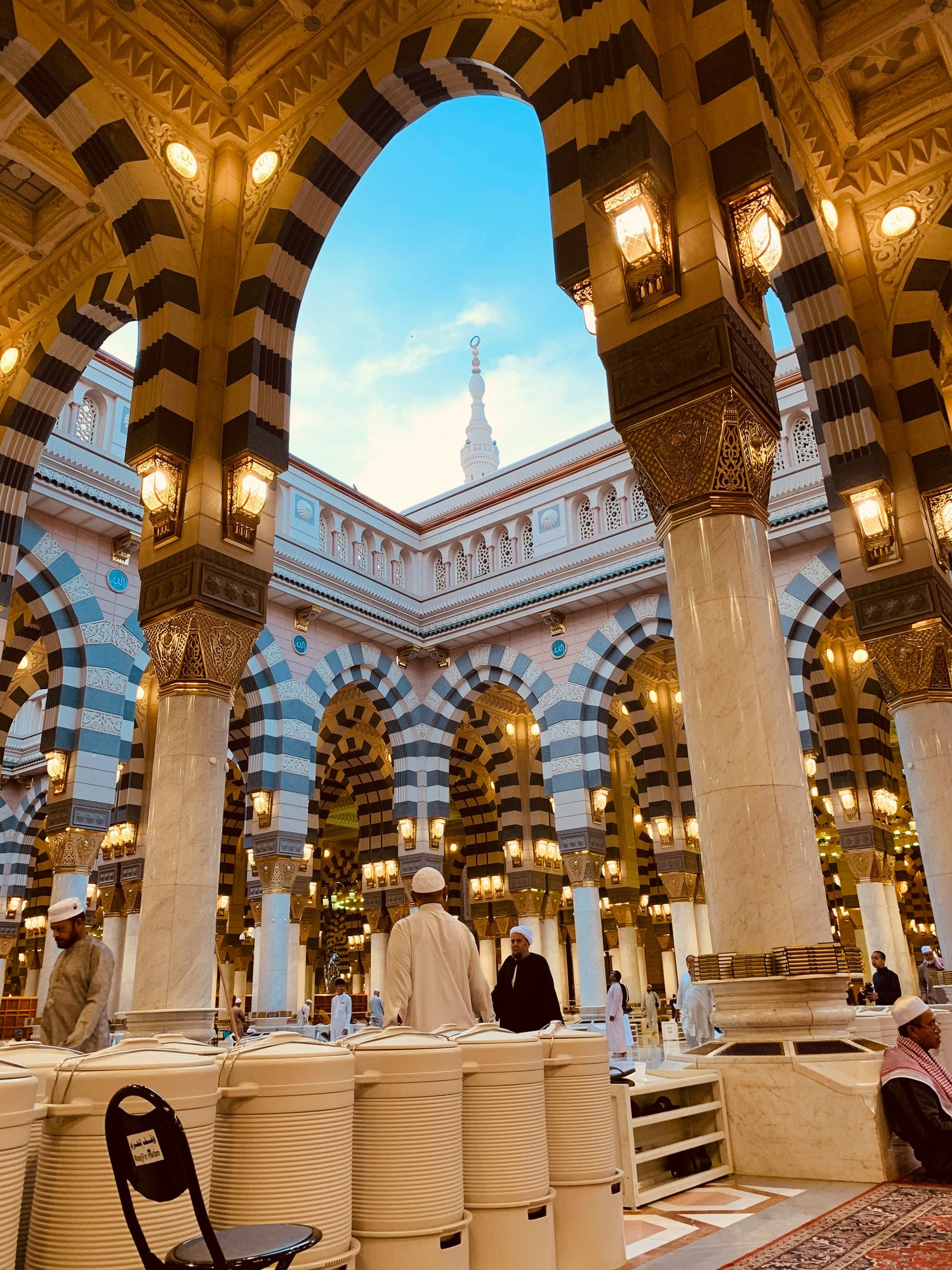 The ornate columned interior of the Prophet's Mosque in Madinah